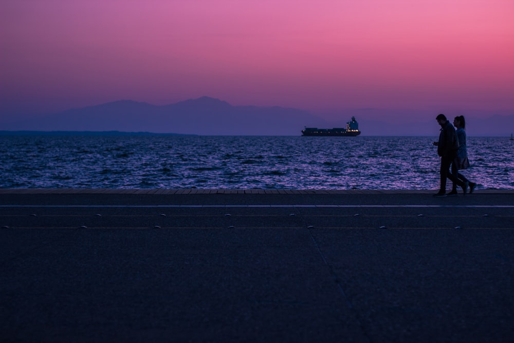 a couple walking on a beach