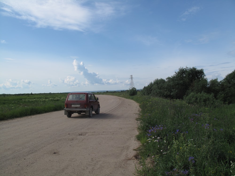 a car parked on a dirt road