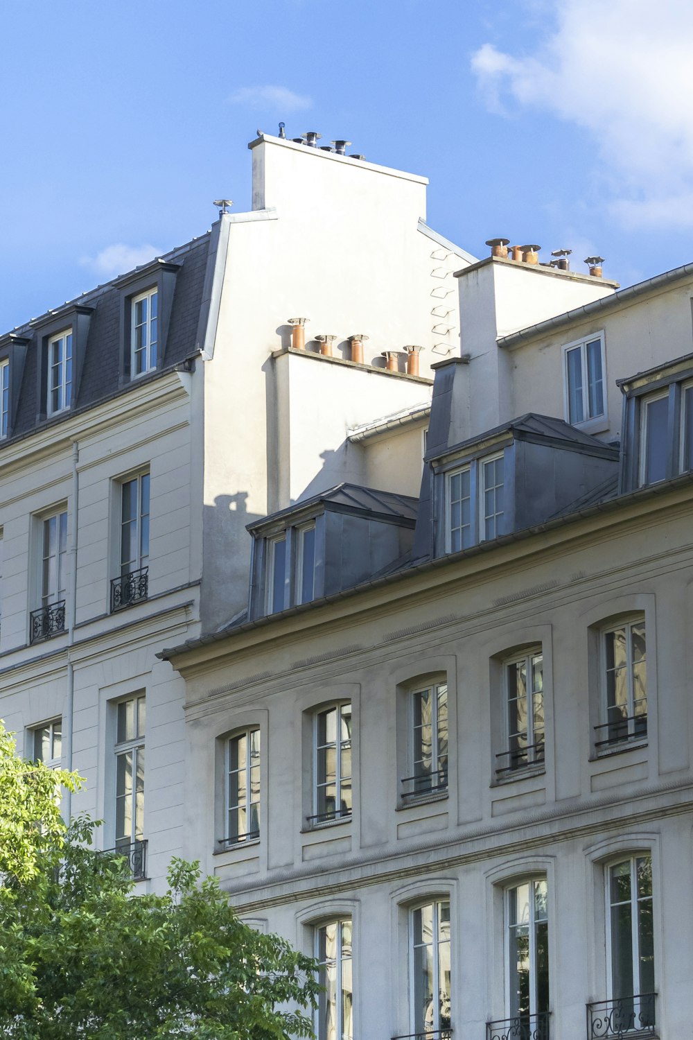 a building with a tree in front