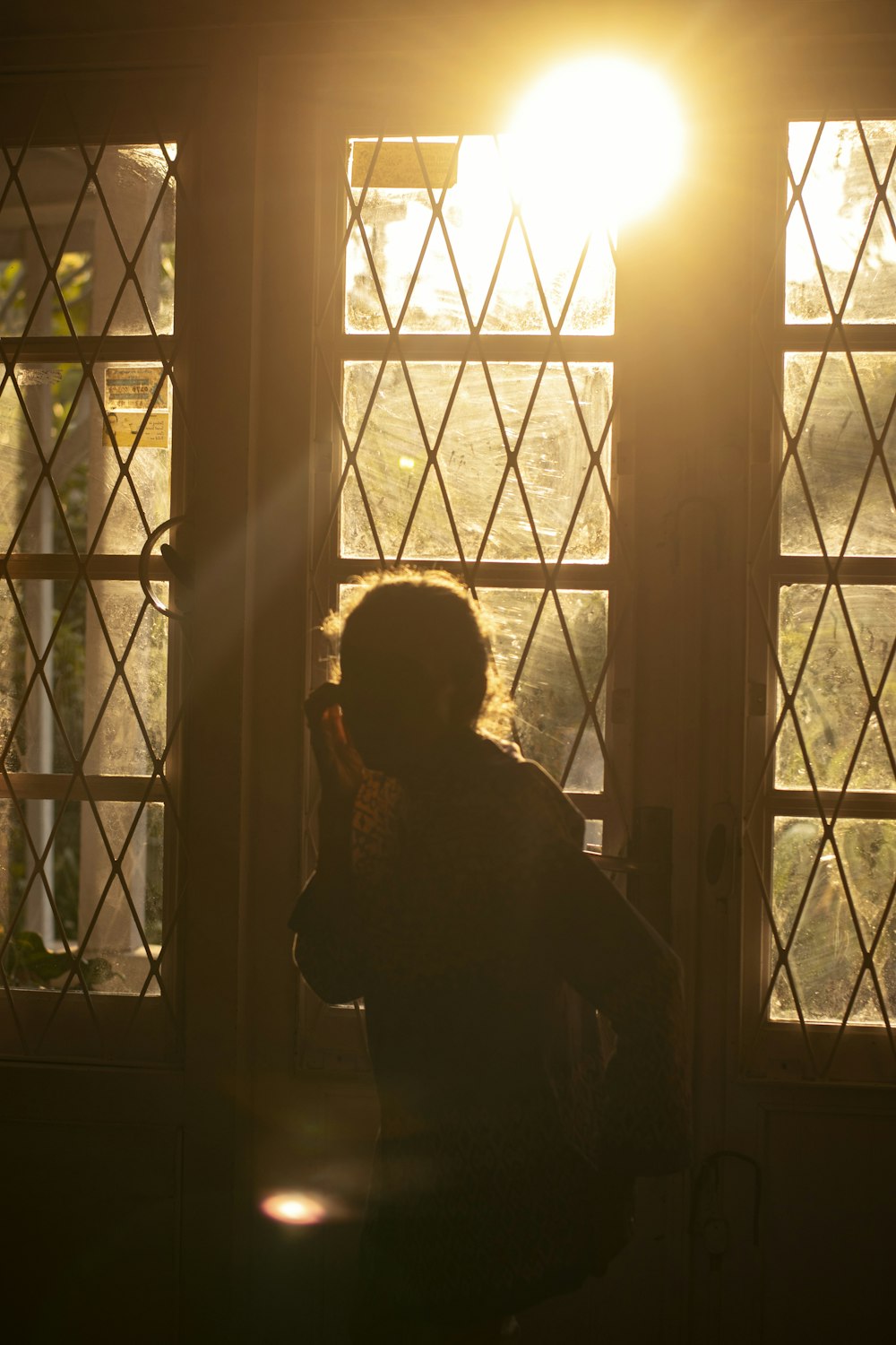 a person standing in front of a window