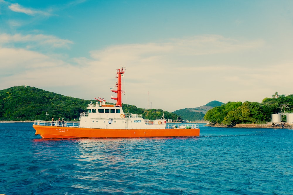 a large orange and white boat