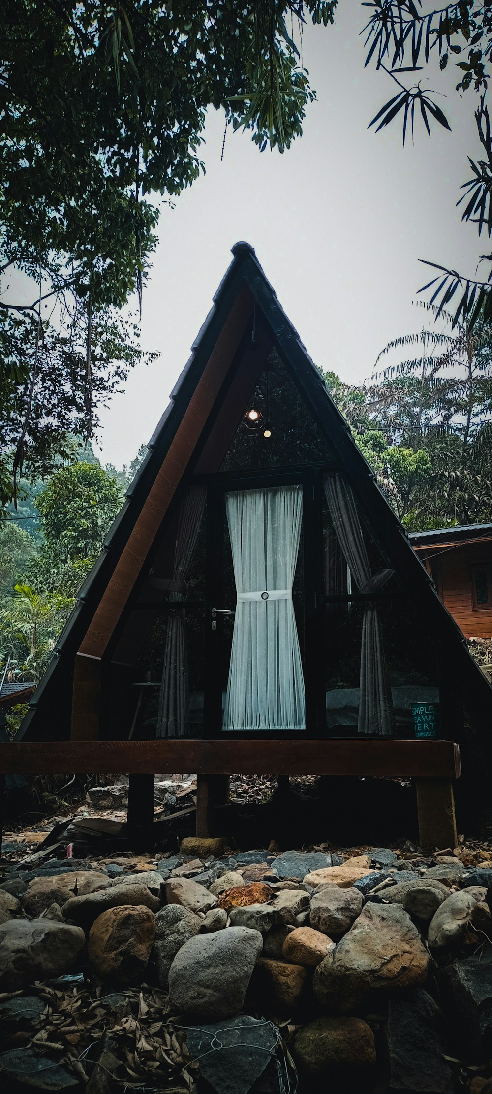 a wooden building with a glass window