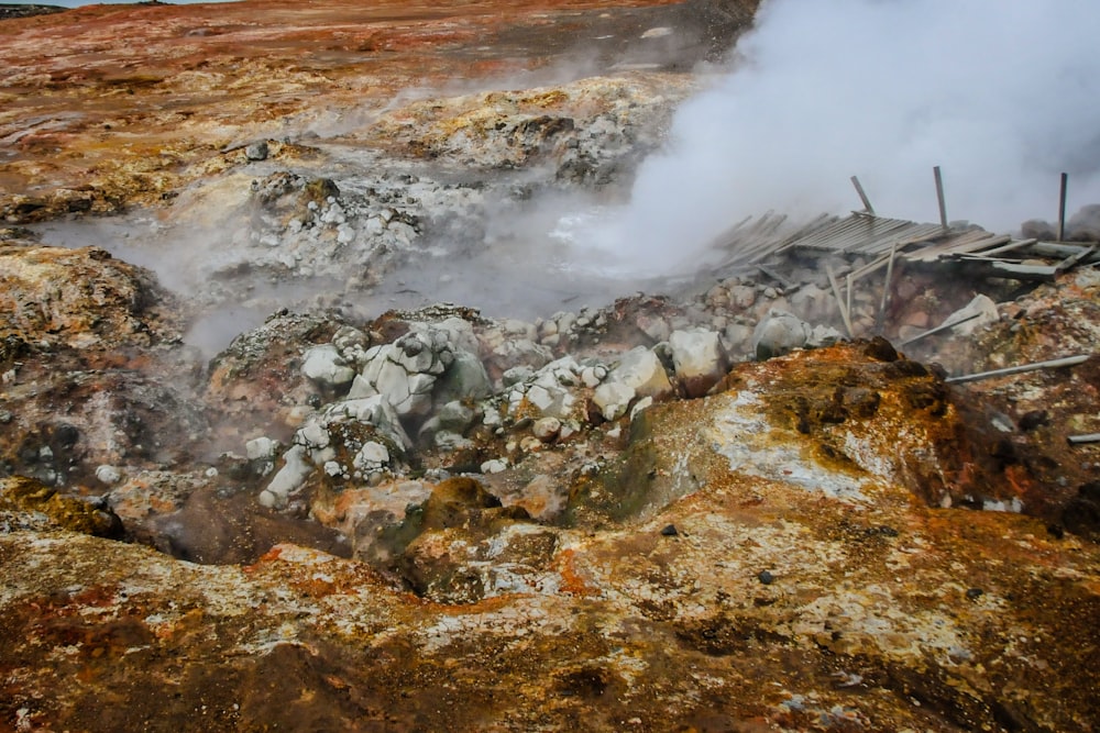 a rocky area with smoke coming out of it