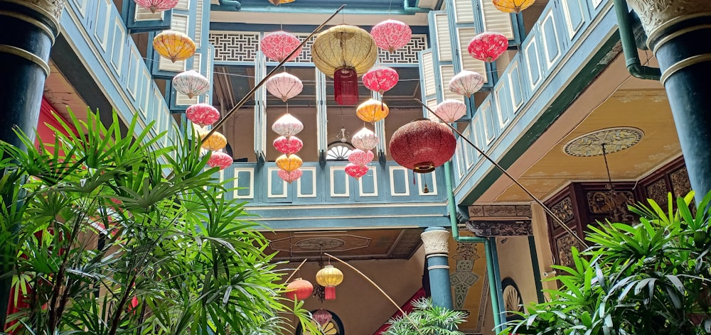 a building with many lanterns from the ceiling