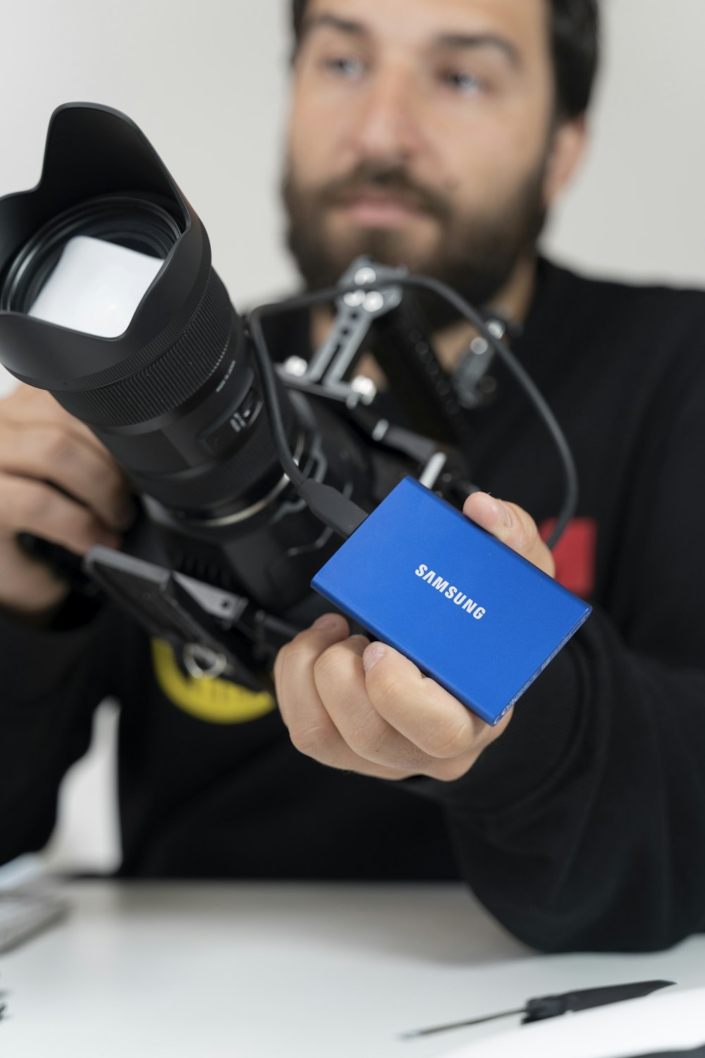 a person holding a pair of headphones