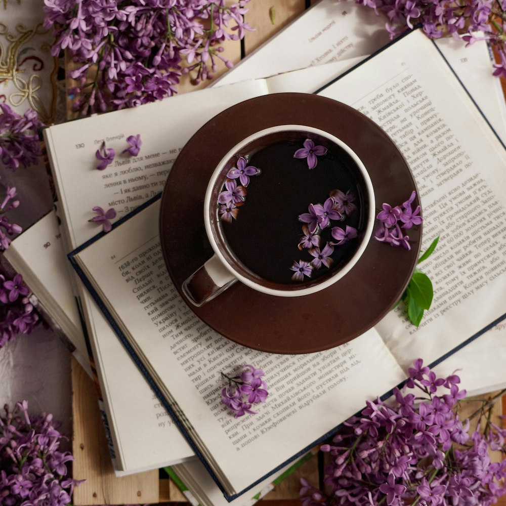 a cup of coffee on a book