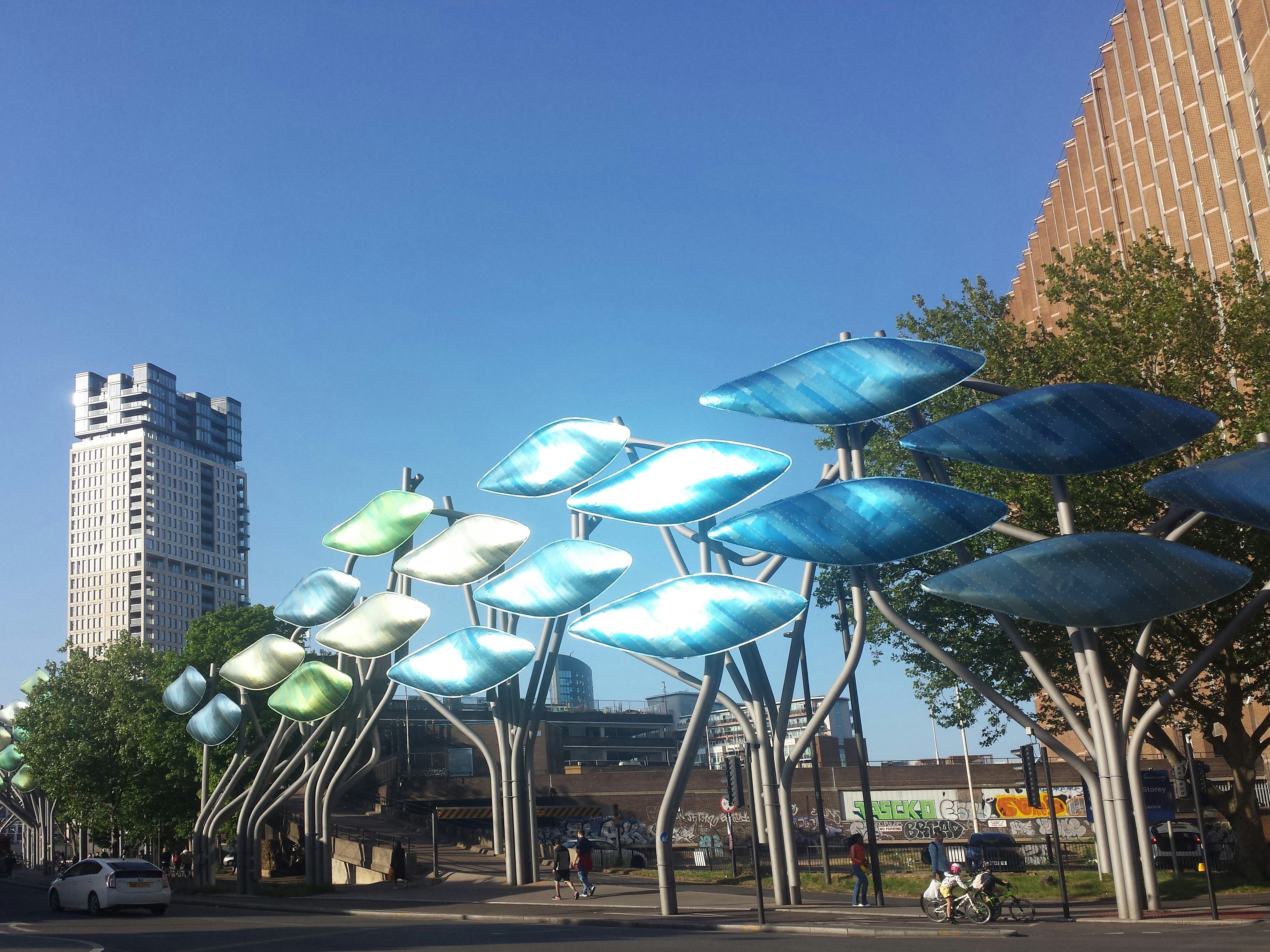 a group of umbrellas are in the air