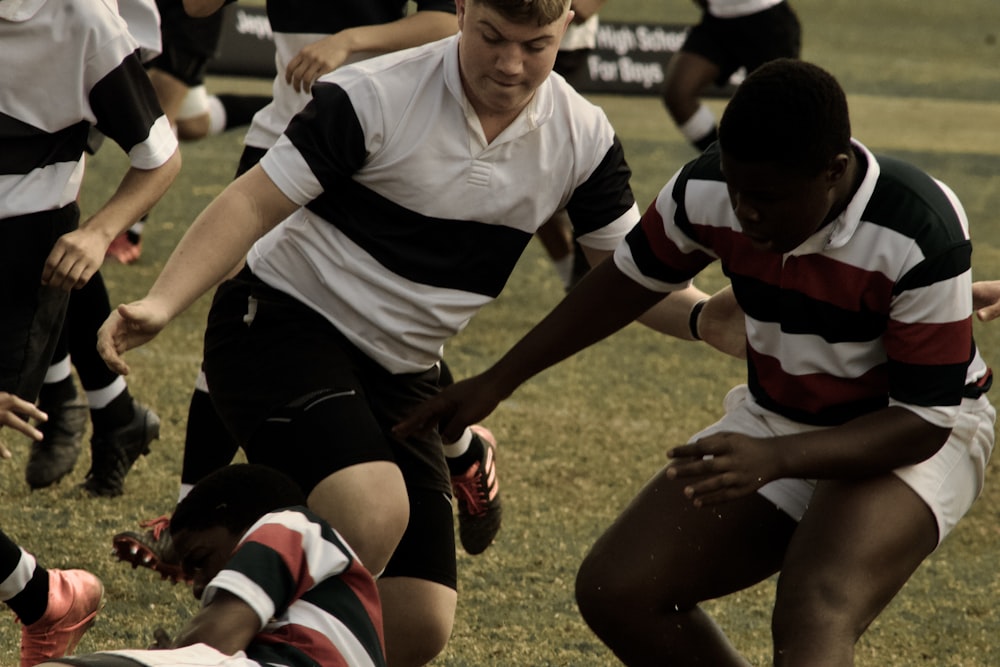 a group of men playing rugby