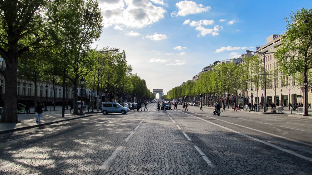 A street with trees and buildings on the side with Champs-Élysées