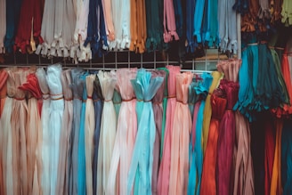 a rack of colorful clothes