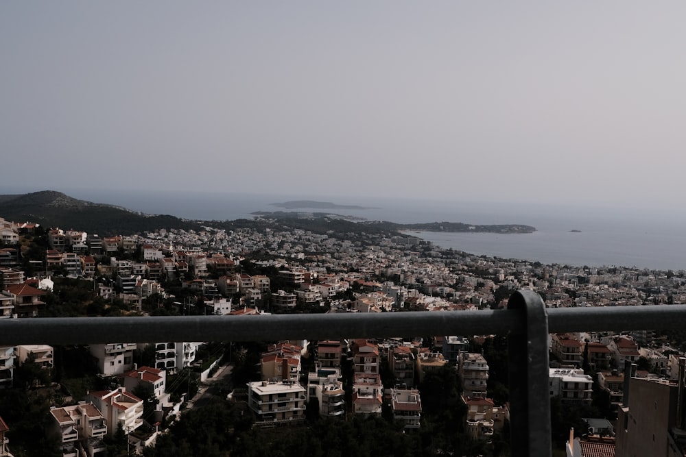 a city with a body of water in the background