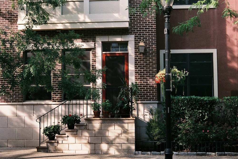 a brick building with a black railing