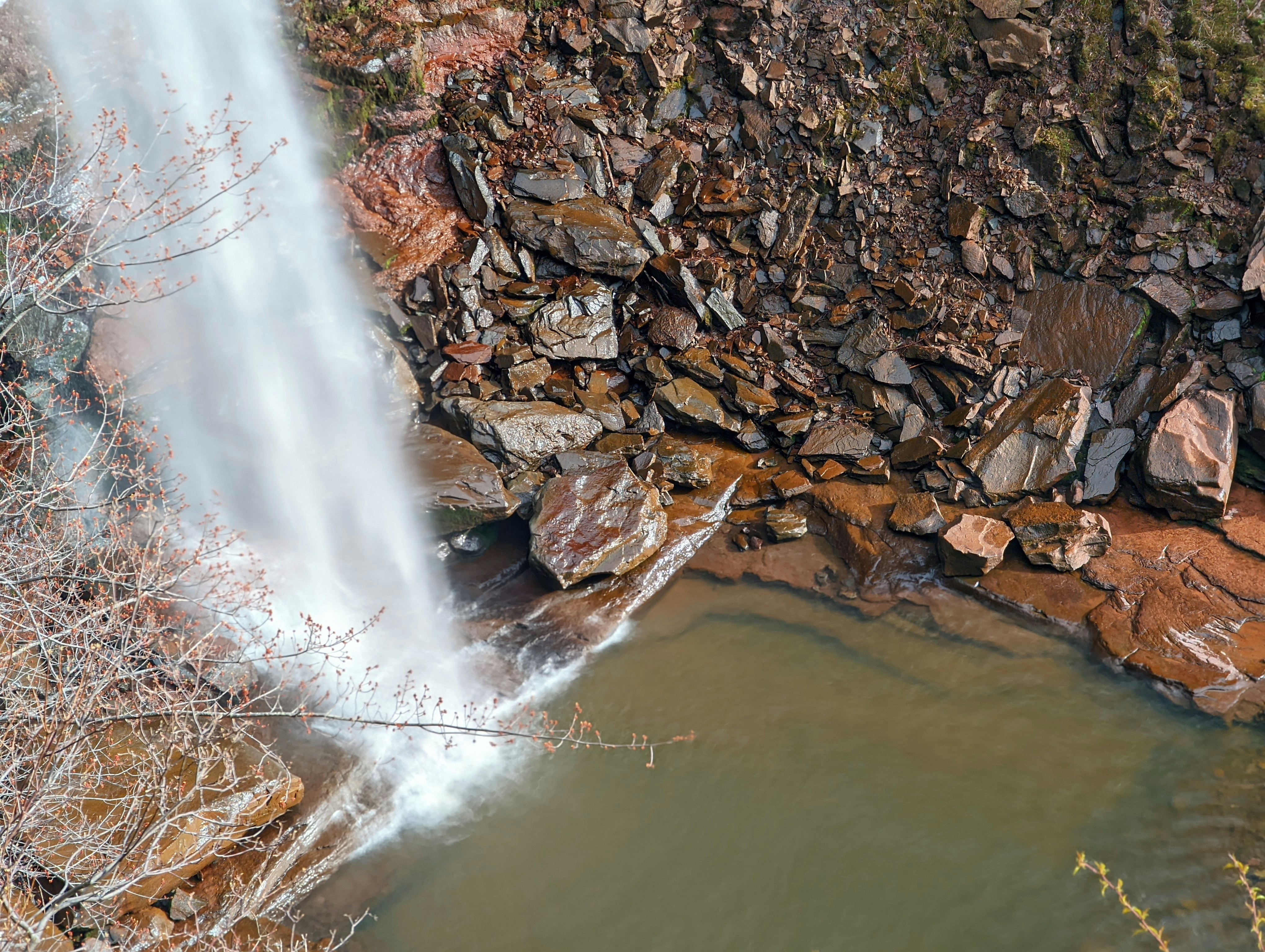 a waterfall over a rocky cliff