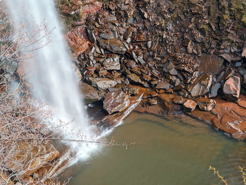 a waterfall over a rocky cliff