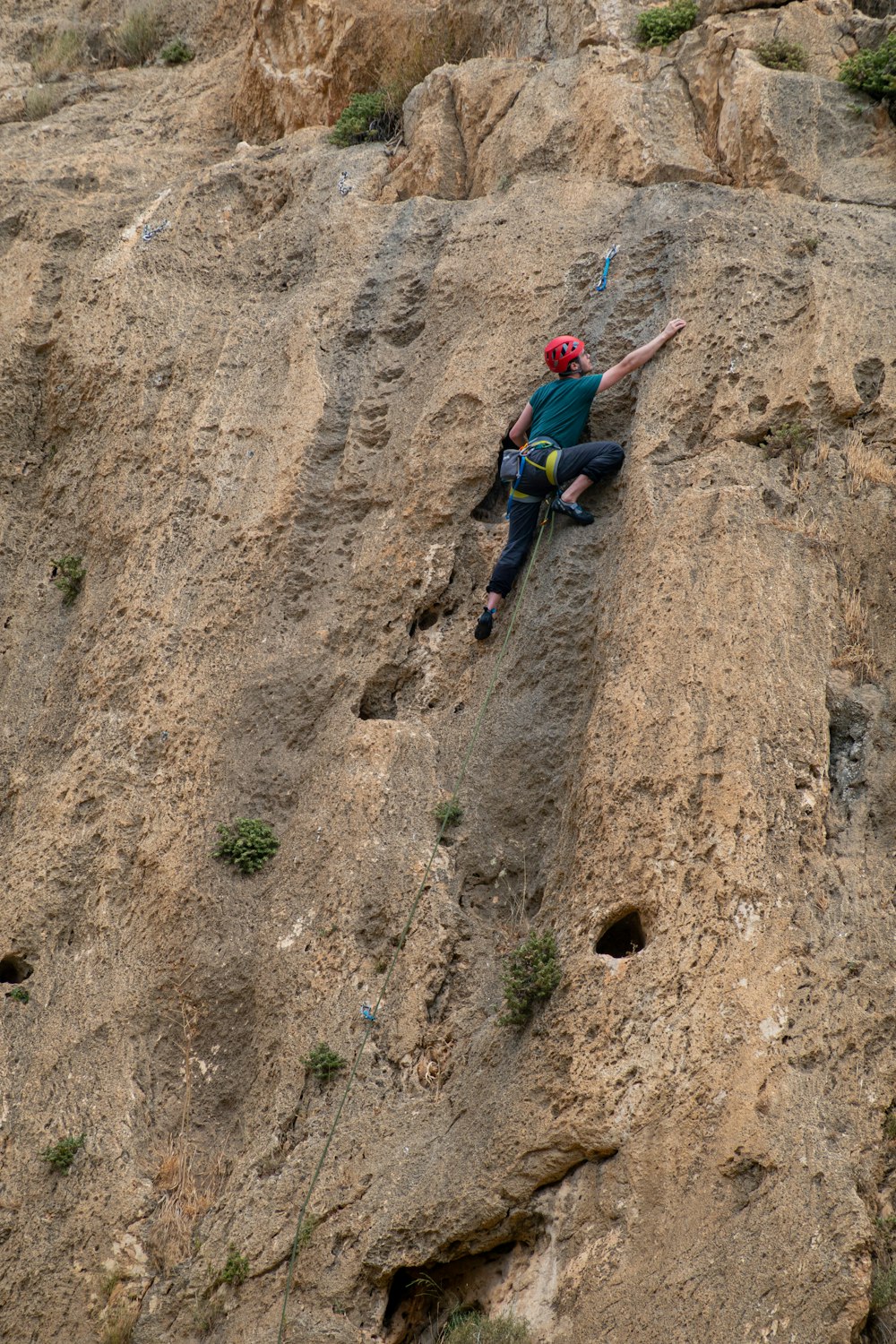 a person climbing a rock
