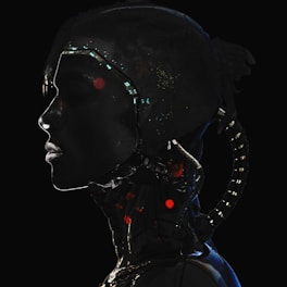 A silhouette of a human-like figure with cybernetic elements, featuring illuminated circuits and lights. The profile is dark with prominent bright accents highlighting the futuristic design.