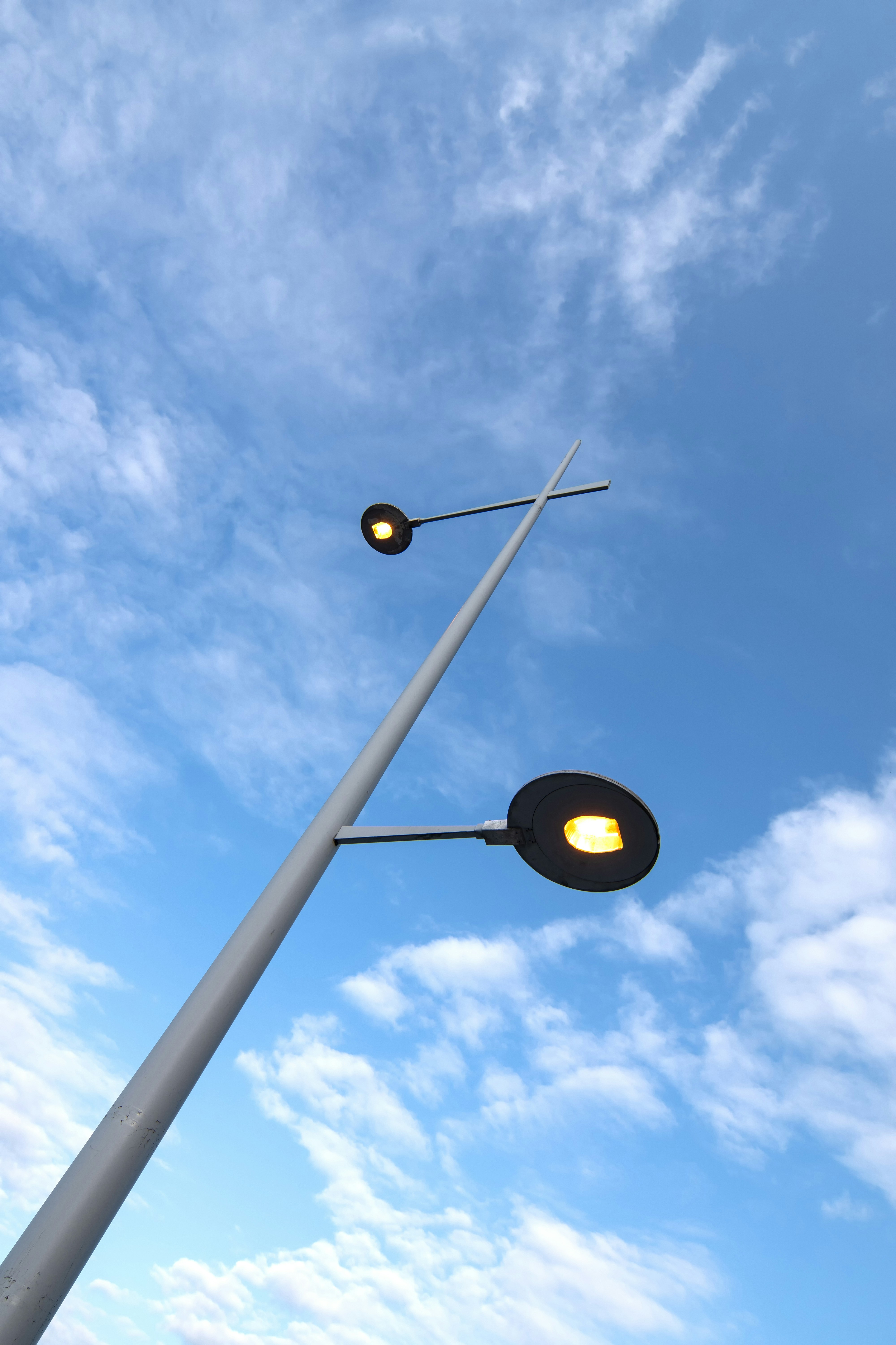 a street light with a blue sky