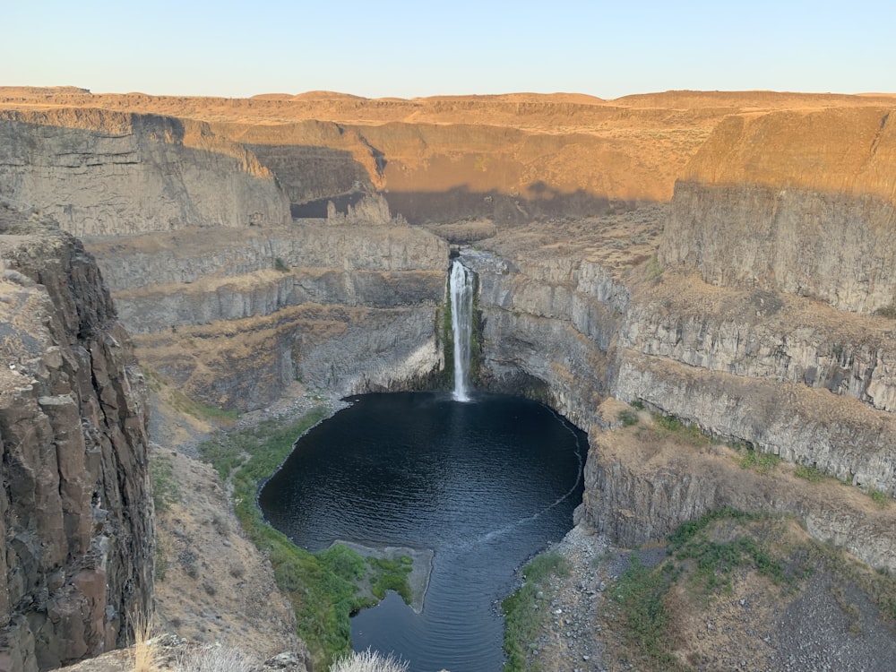 a waterfall in a canyon