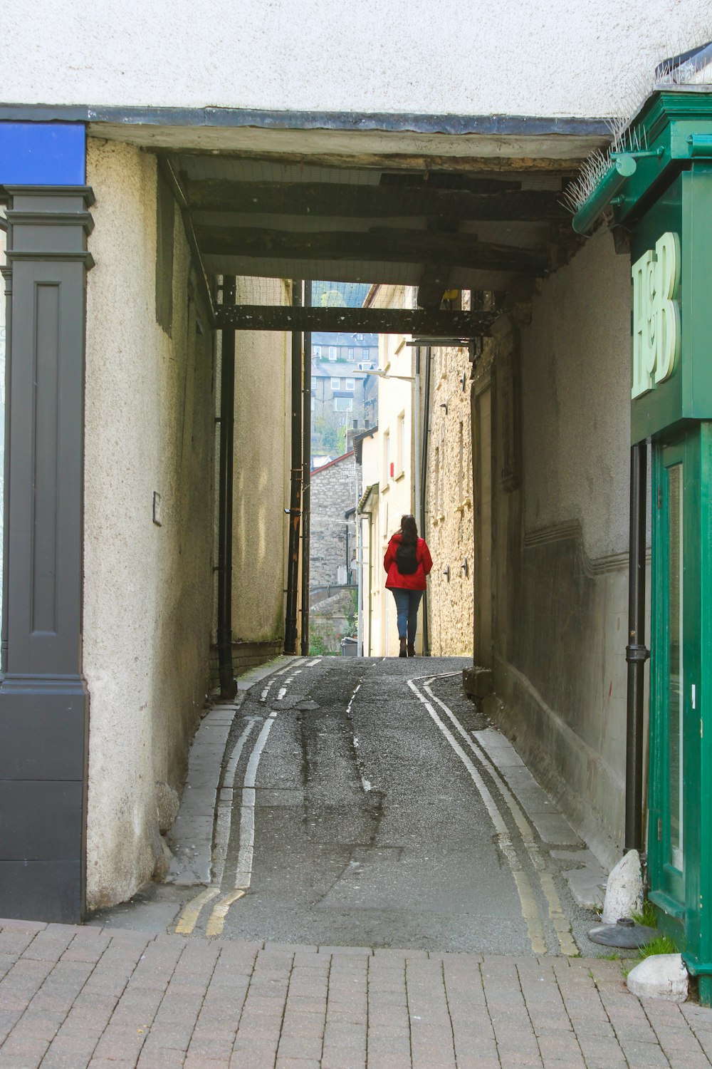 a person walking through an alley