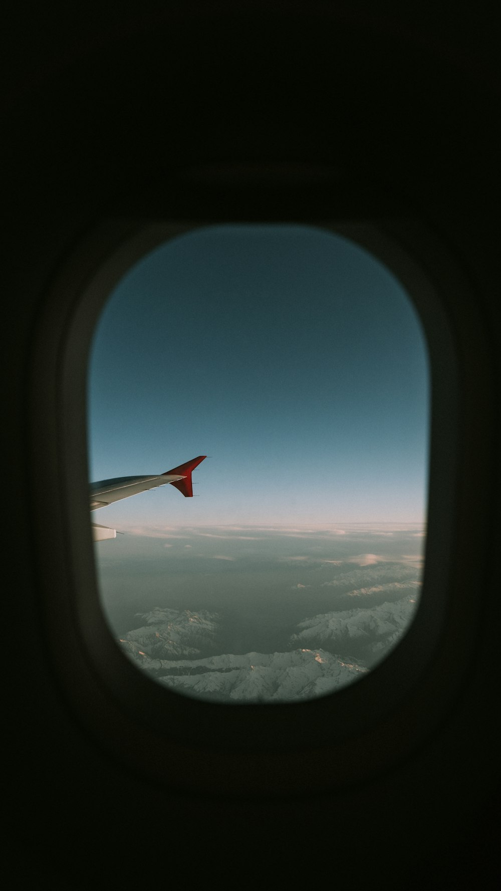 an airplane wing in the sky