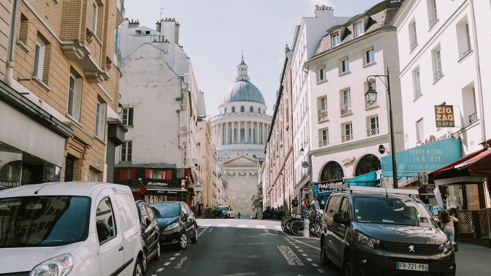 a street with cars and buildings on either side of it