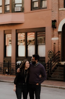 A friendly real estate agent showing an apartment to a happy couple.