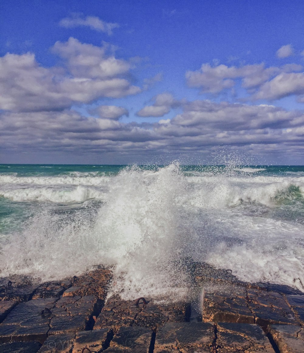 waves crashing on rocks