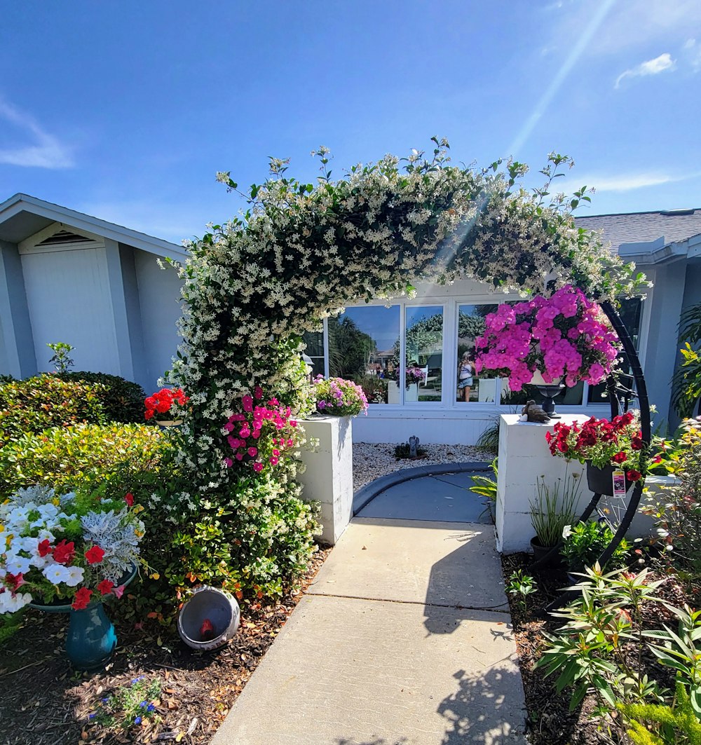 a house with a large flower bed