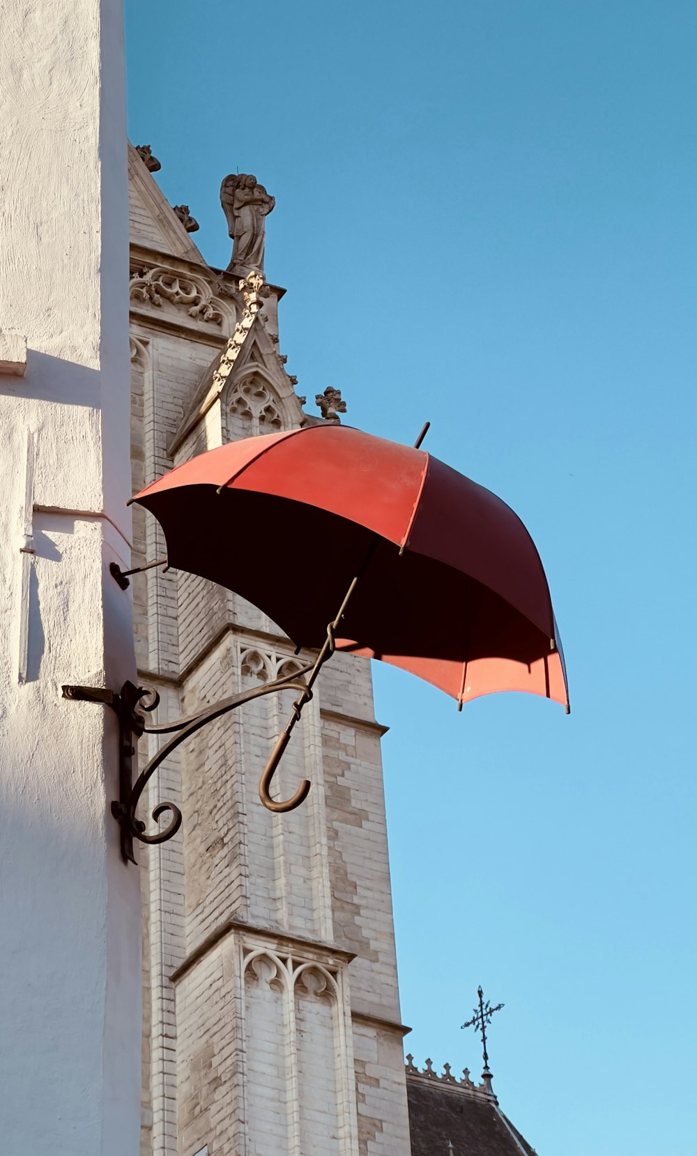 a red umbrella on a building
