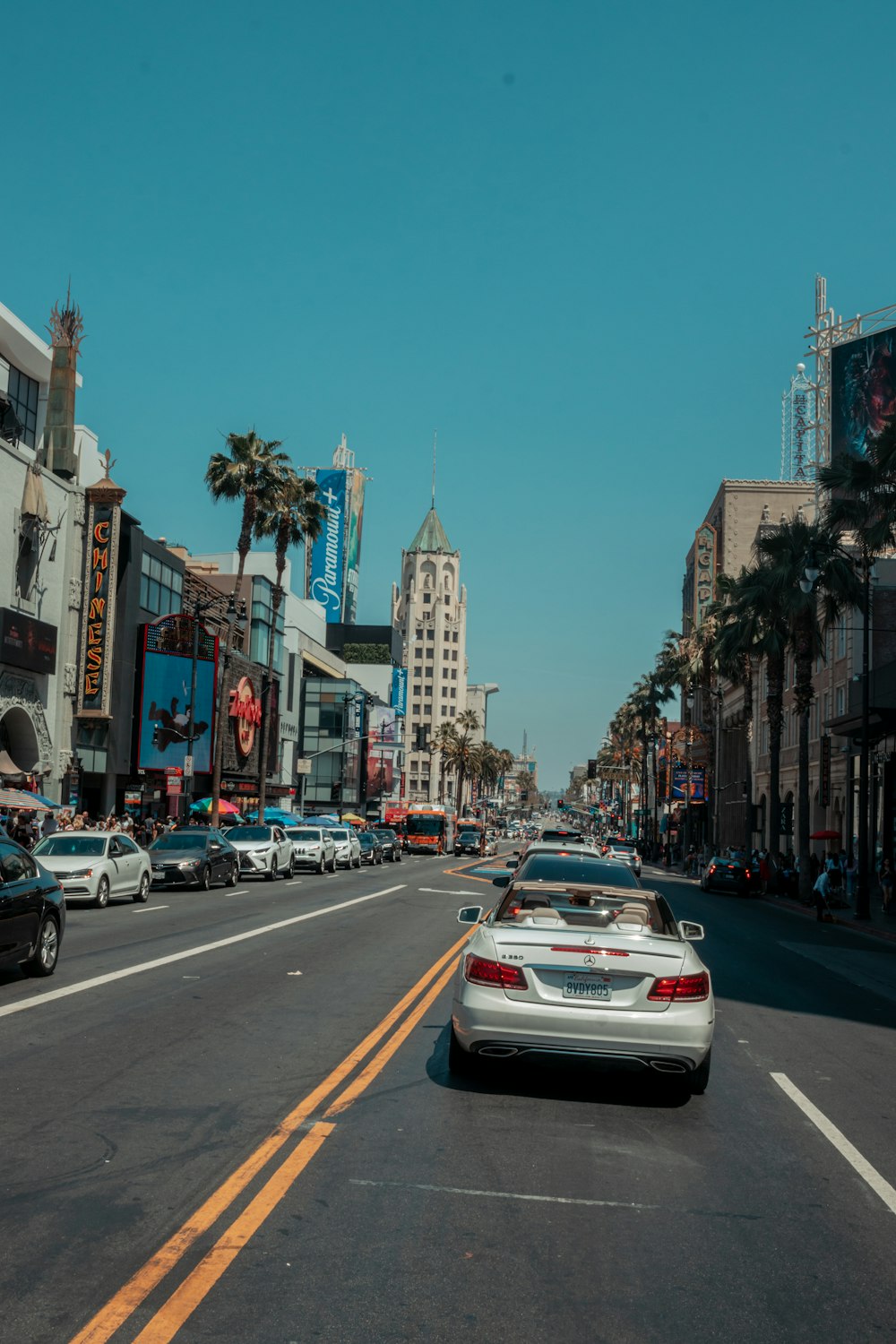 a busy street with cars and buildings