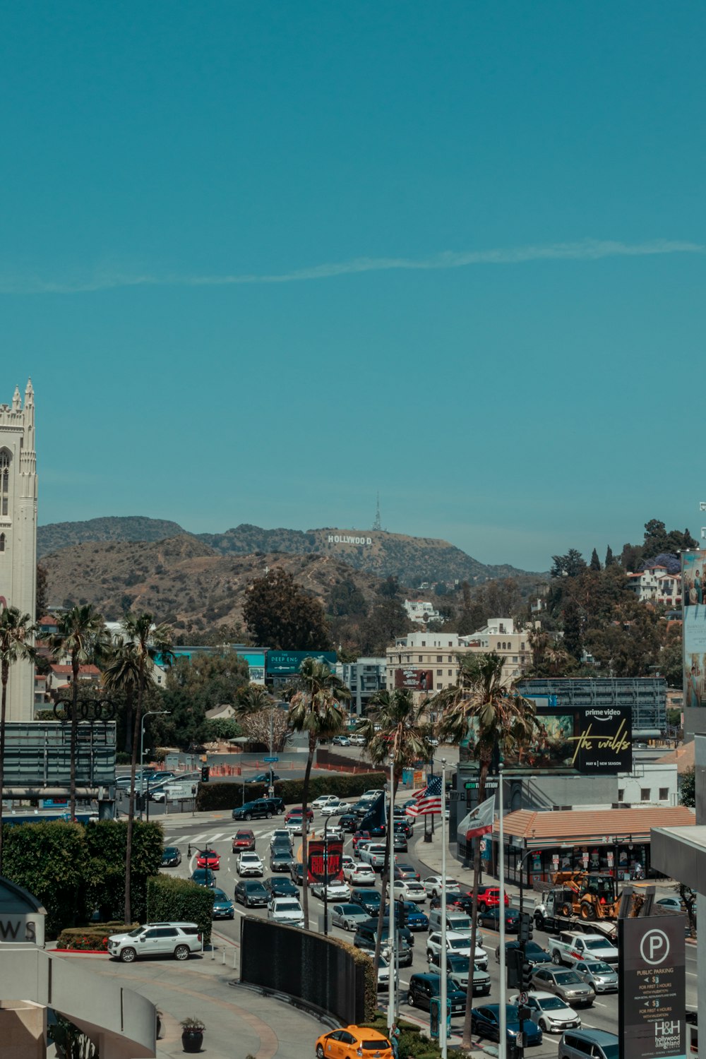 a city with many cars and trees