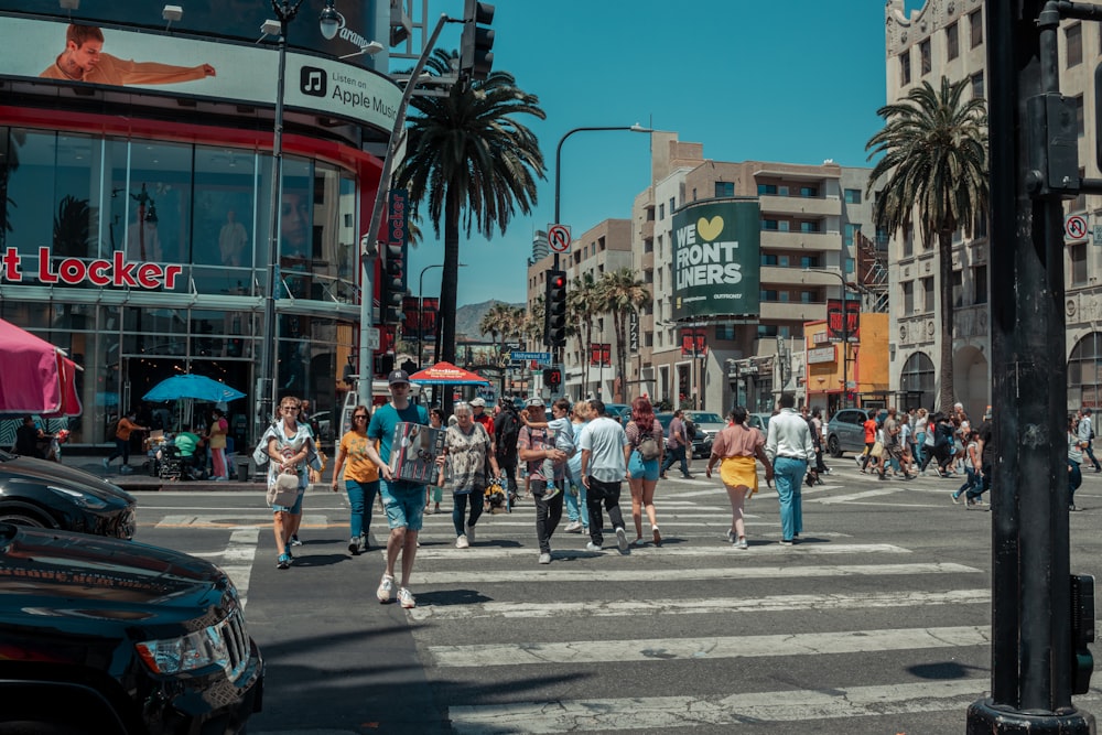 a crowd of people crossing a street