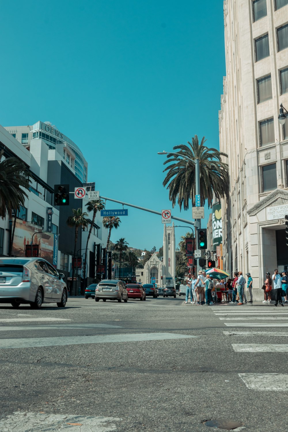 a street with cars and people