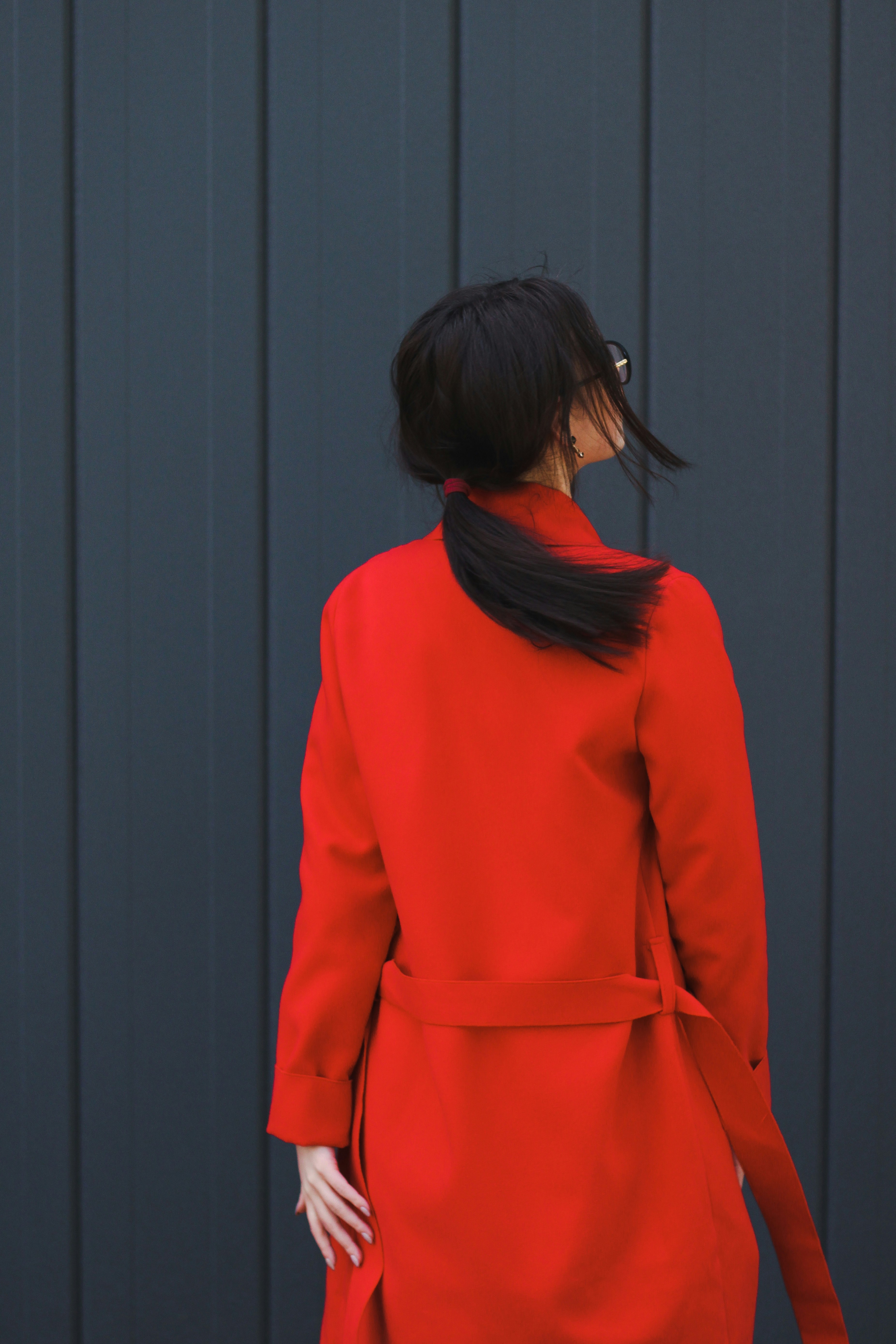 a person wearing a red coat