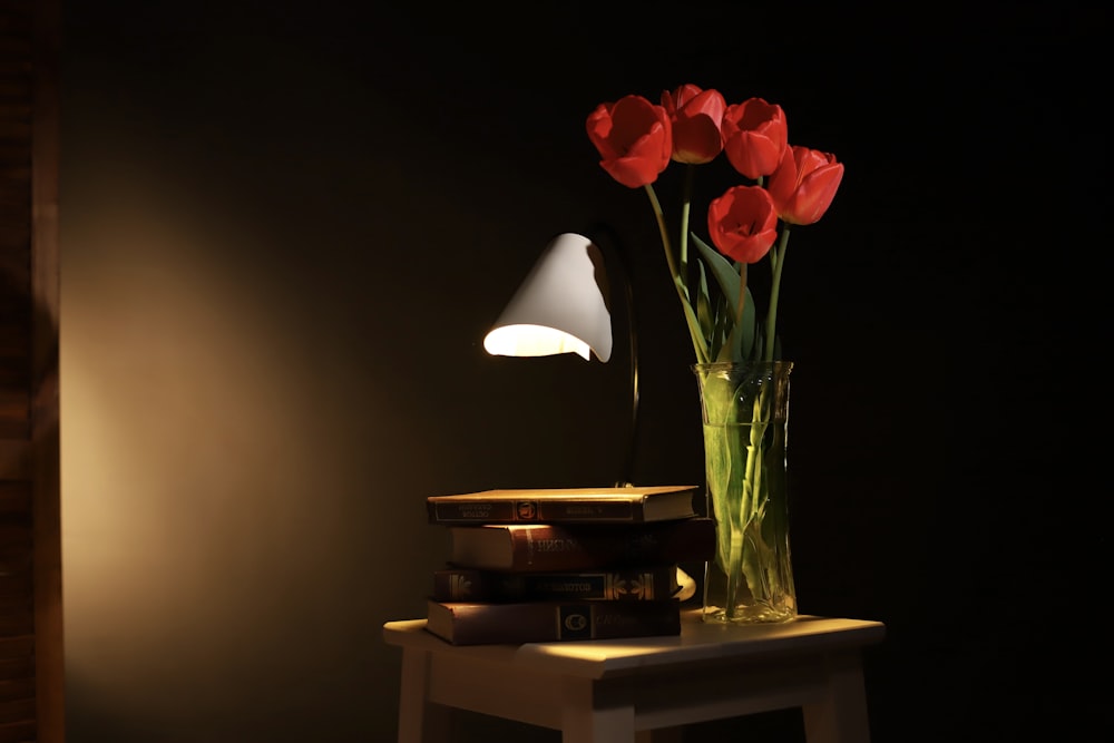 a vase filled with flowers sitting on a table