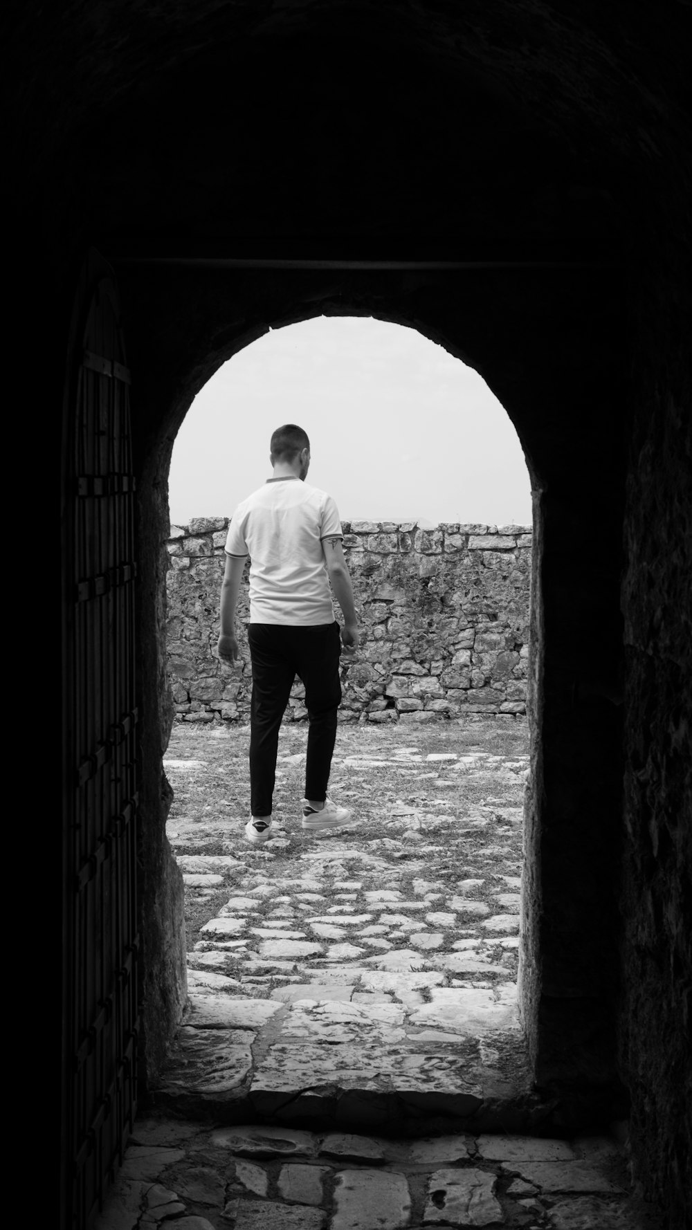 a man walking through a doorway