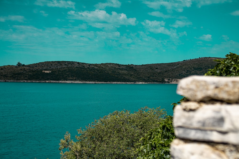 a rocky cliff overlooking a body of water