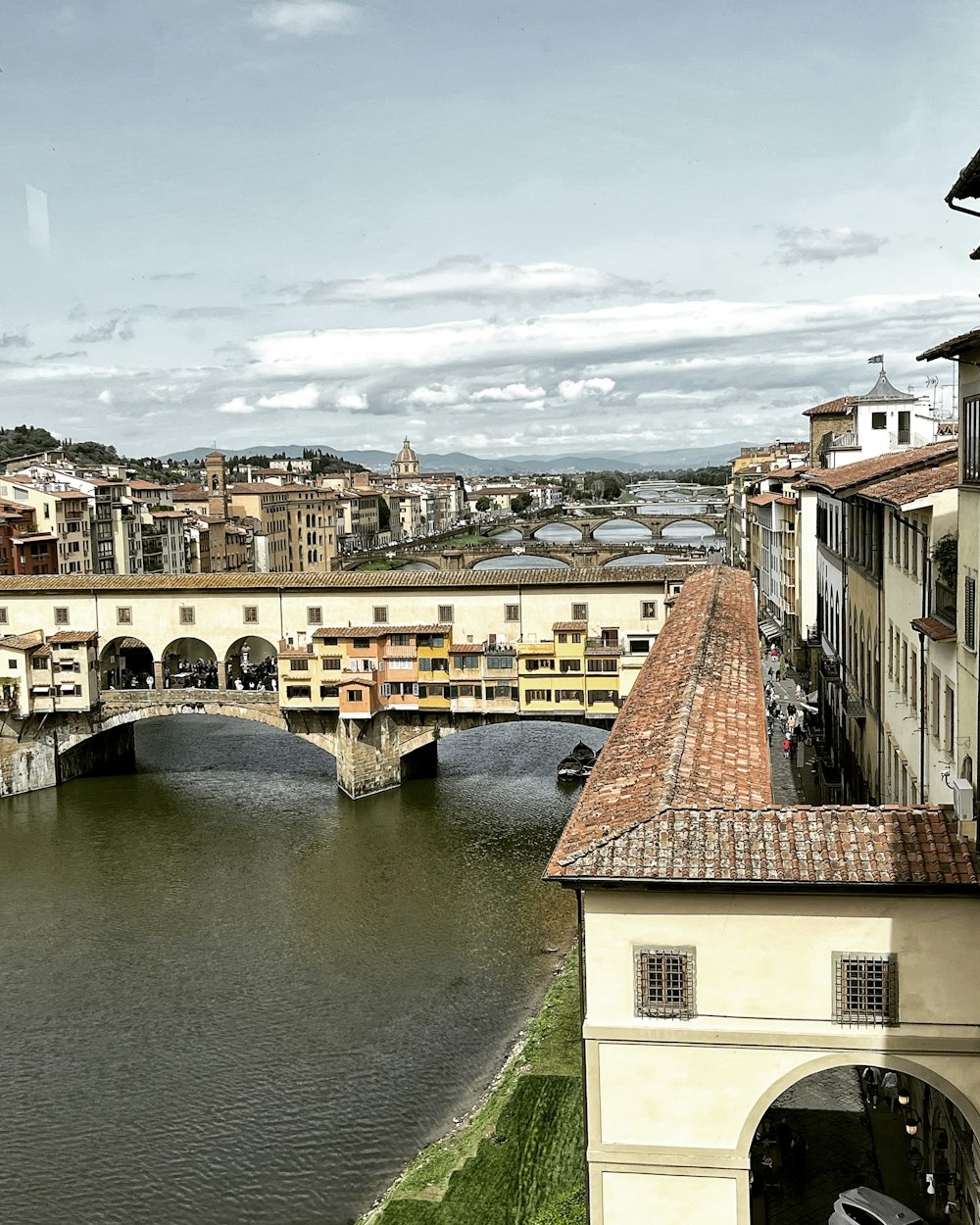 a bridge over a river with buildings on either side of it