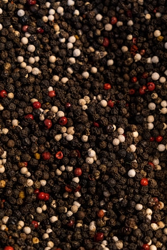 a close up of a pile of red and white pebbles