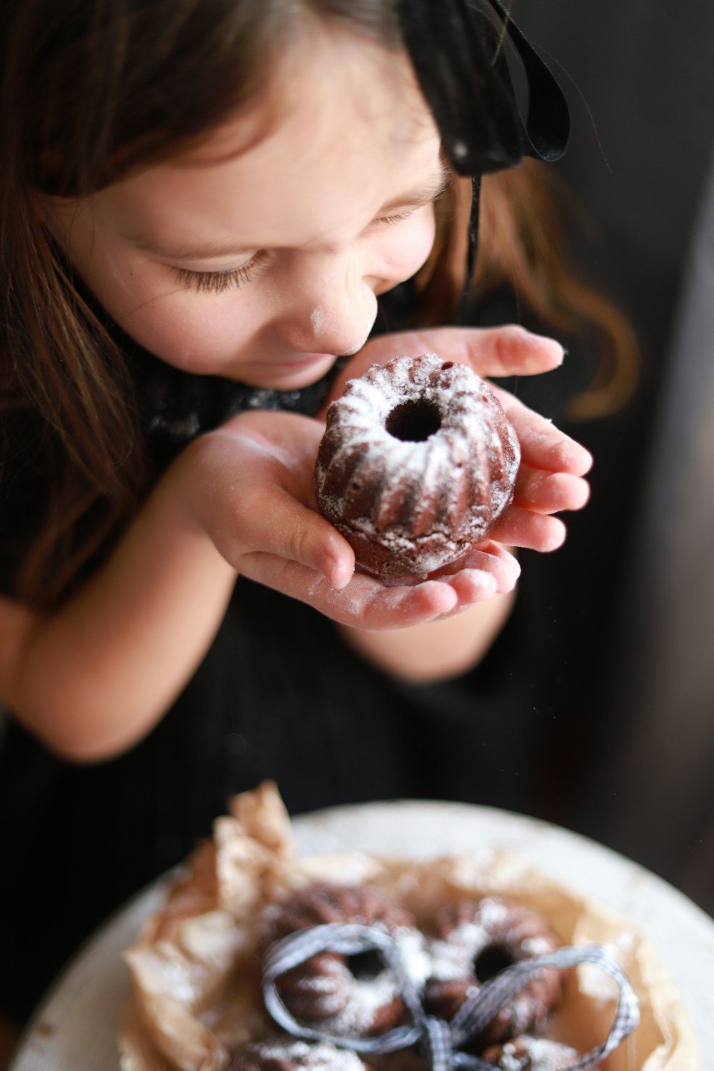 a girl eating a donut