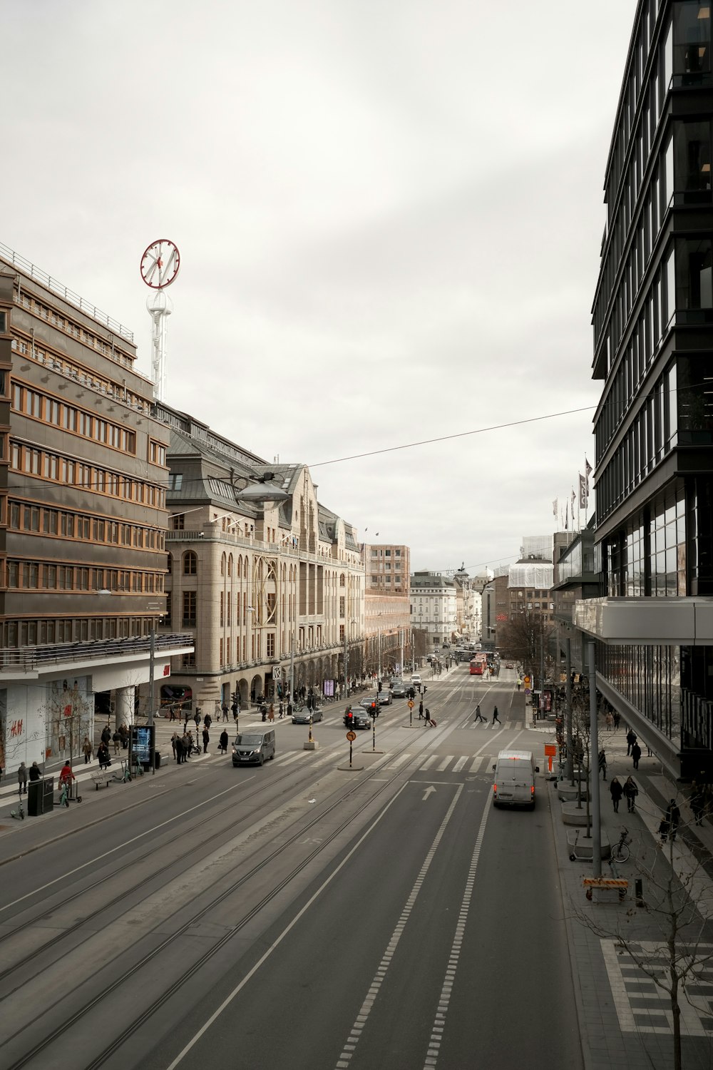 a city street with cars and people