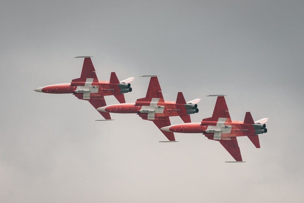 a group of airplanes flying in the sky