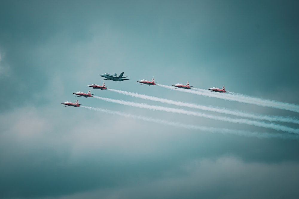 a group of jets fly through the air