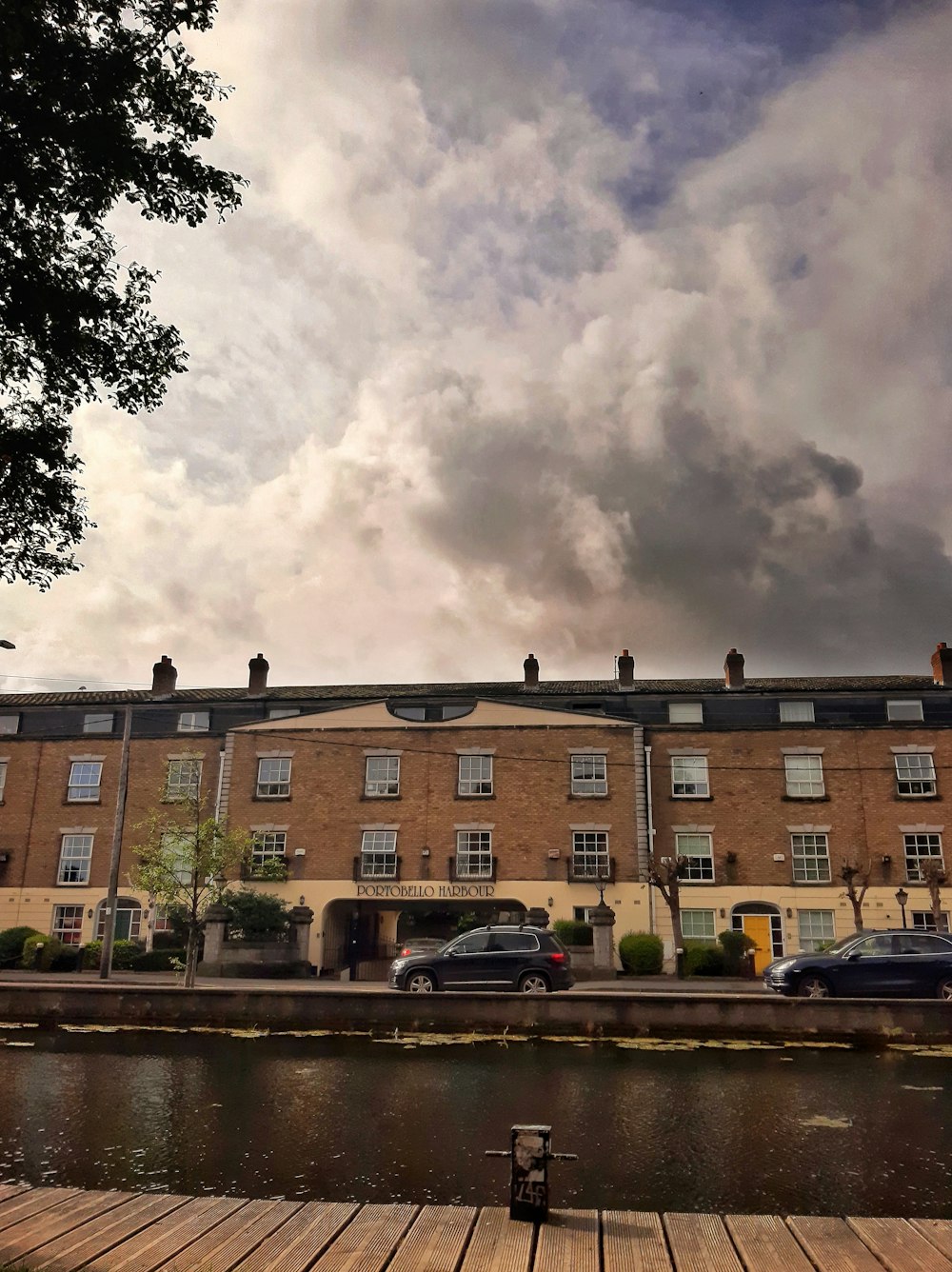 a building with a large cloud of smoke in the sky