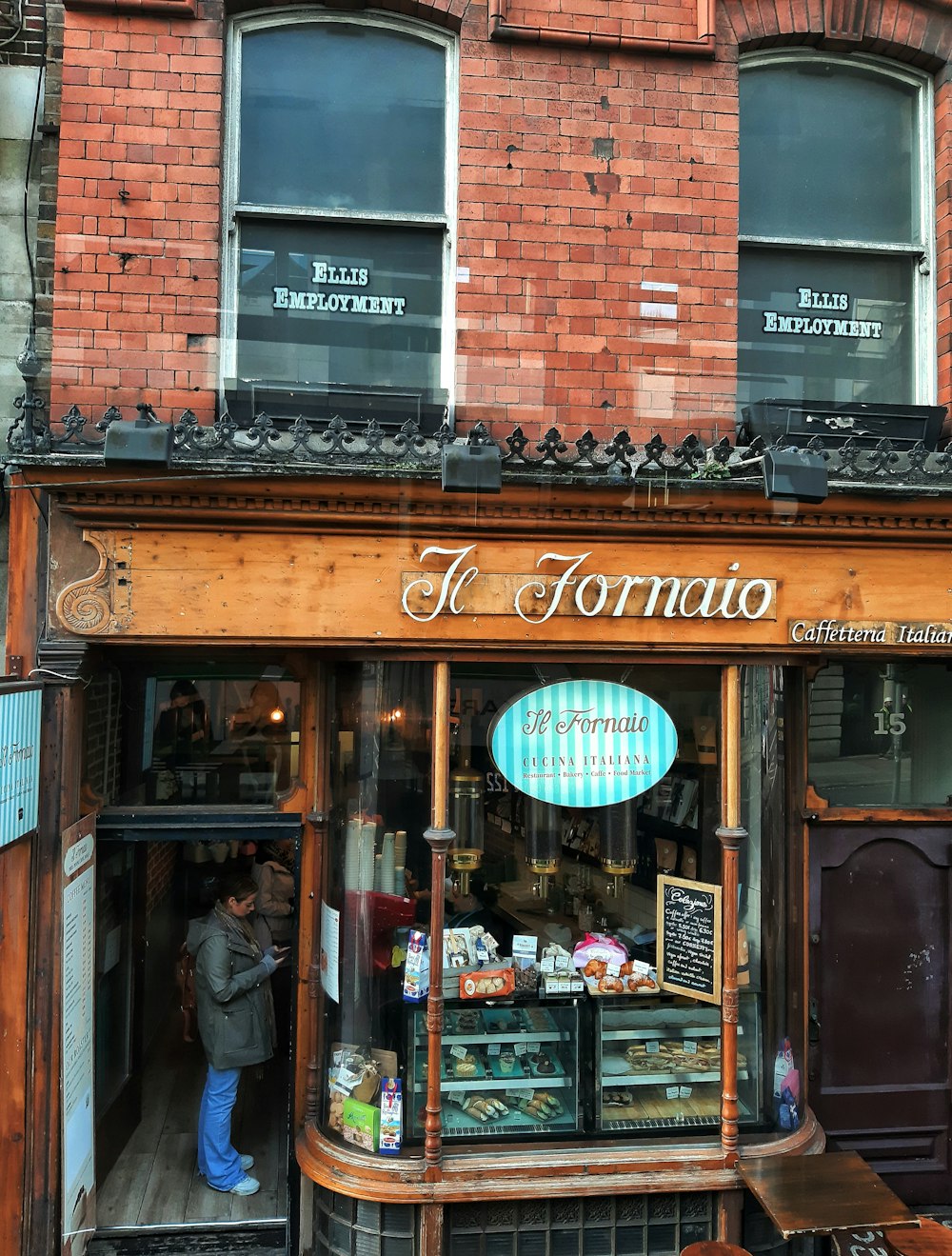 a store front with a person standing in the window