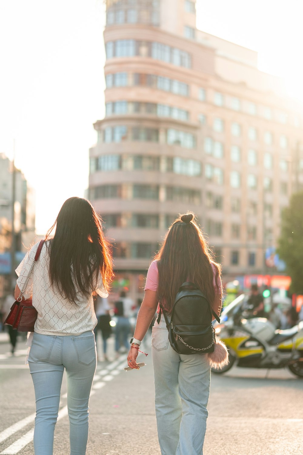 two women walking on a street