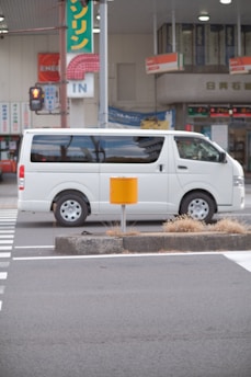 a white van parked on the side of a street