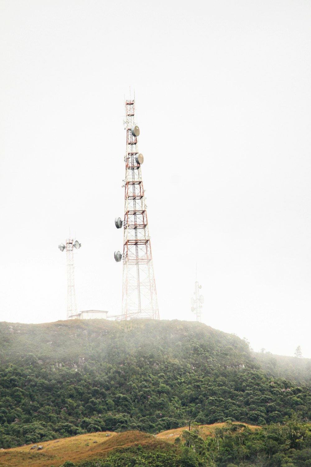 a tall tower on a hill