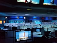 a room with many screens and monitors