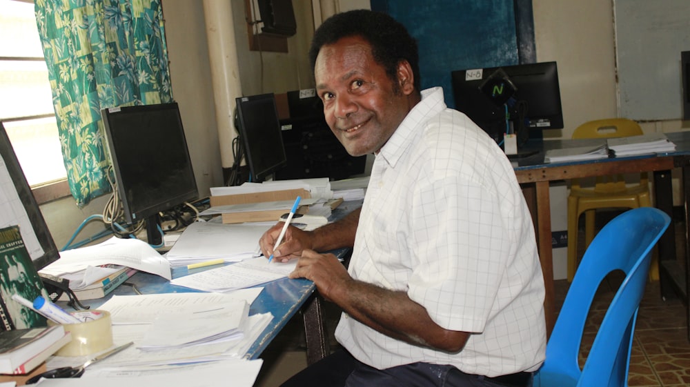 a man sitting at a desk